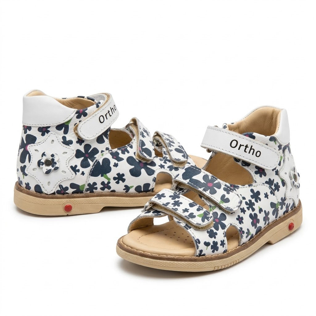 Mid-top orthopaedic girls sandals showing rigid heel counter, star cutout detail, and Thomas heel support.