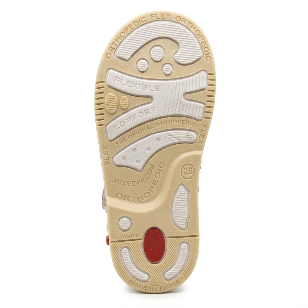 Orthopaedic textured traction outsole featuring built-in Thomas heel and shock-absorbing zone.