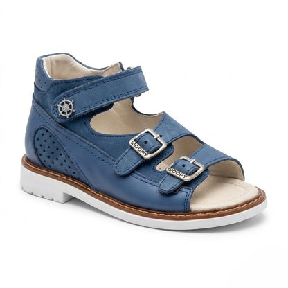 Blue mid-top orthopaedic sandals with a sturdy white sole, Thomas heel, perforated leather, and ship helm charm.