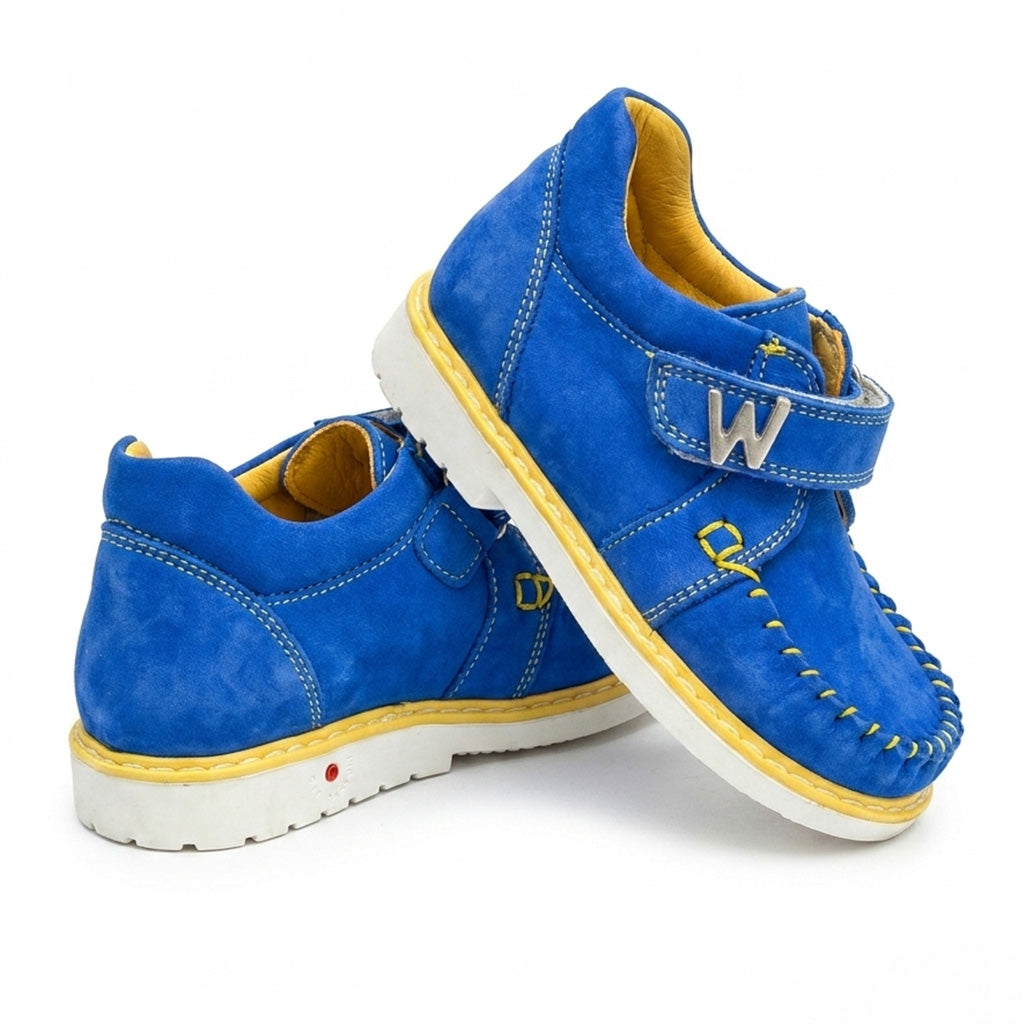Blue orthopaedic toddler moccasins with yellow stitching, structured support, and a single Velcro strap.
