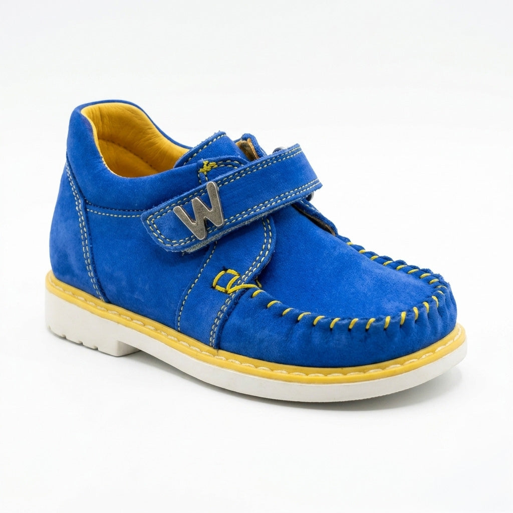 Blue orthopaedic toddler moccasins with yellow stitching, structured support, and a single Velcro strap.