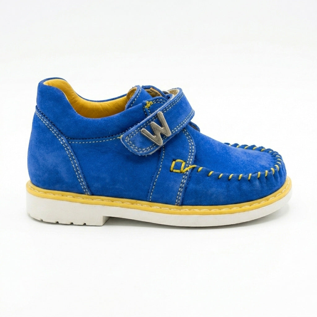 Blue suede toddler shoes showing standard to wide fit, stable low-top collar, and a silver W buckle.