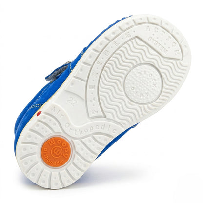 White orthopaedic shoe sole featuring a built-in Thomas heel, shock absorption system, and sturdy traction.