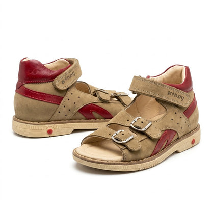Toddler beige orthopaedic sandals showing padded mid-top collar, firm heel counter, and cream Thomas heel sole