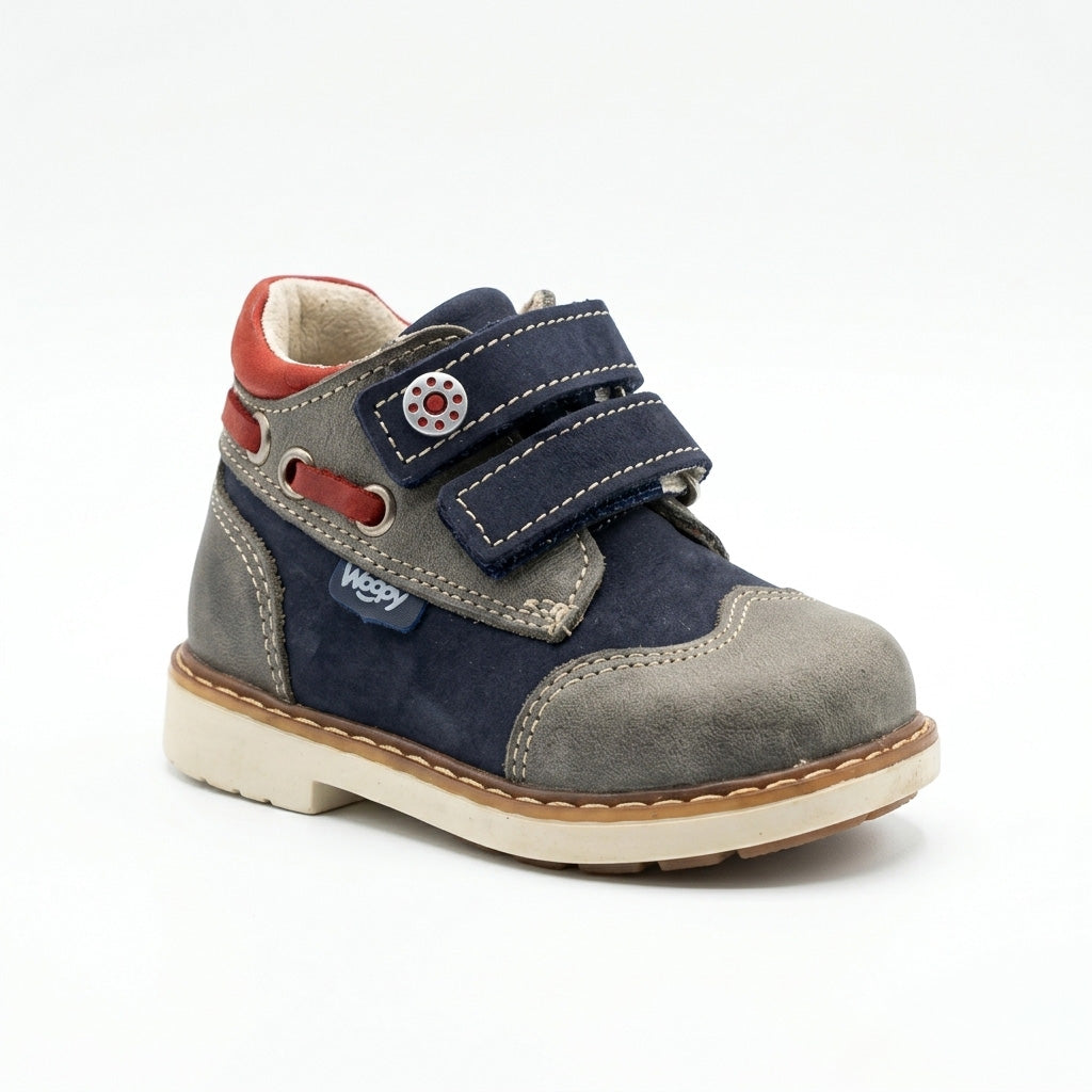 Kids’ orthopedic boots in navy and grey with Velcro straps, cushioned arch support, ankle support, Thomas heels and durable outdoor design by Woopy.