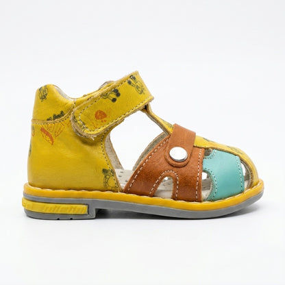 Children’s yellow orthopedic sandal with Velcro strap, brown and turquoise accents, supportive grey sole, featuring arch and ankle support, and playful printed details by Minimen.