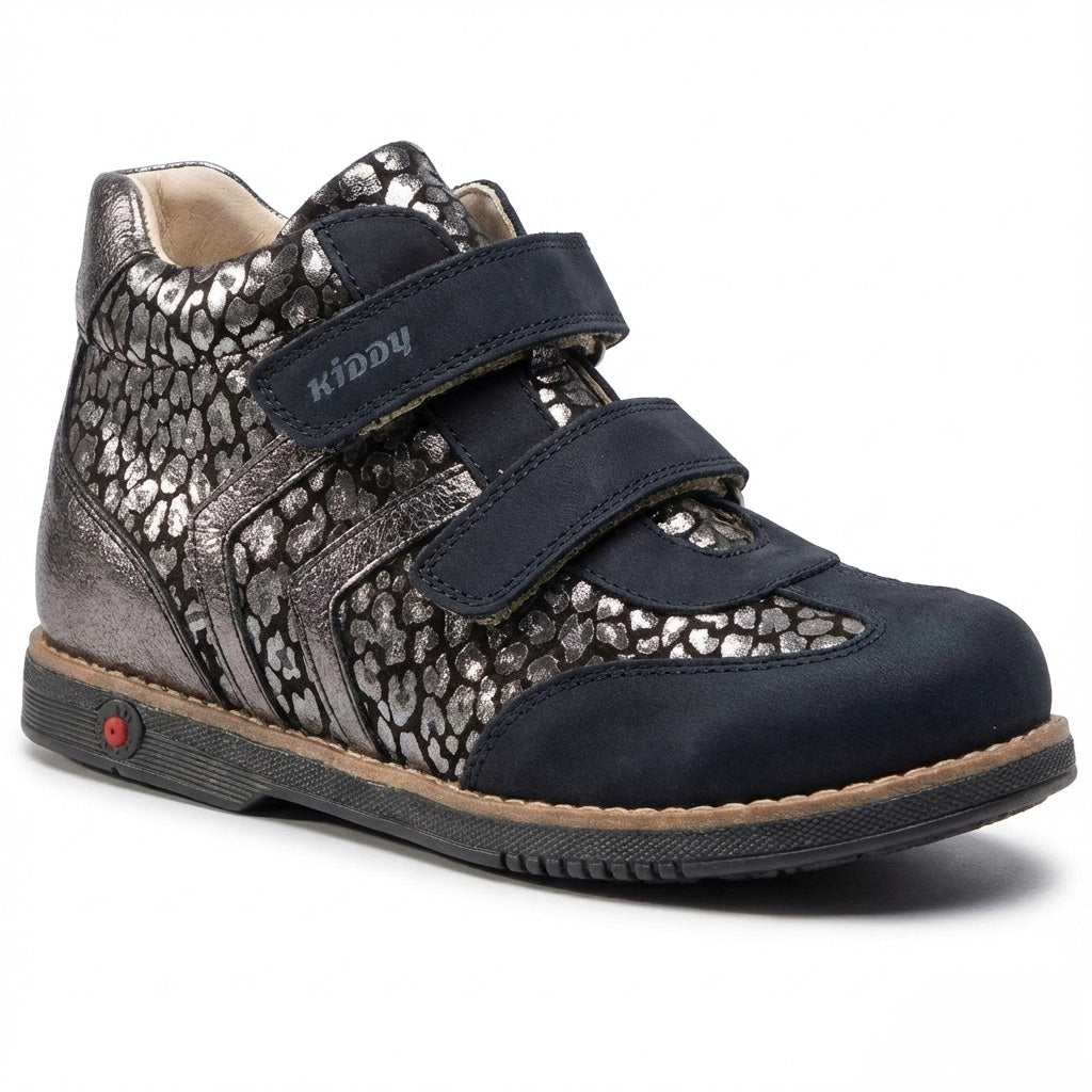 Kids’ orthopedic boots with Velcro straps, metallic pebble design, arch and ankle support, Thomas heels, and Kiddy logo.