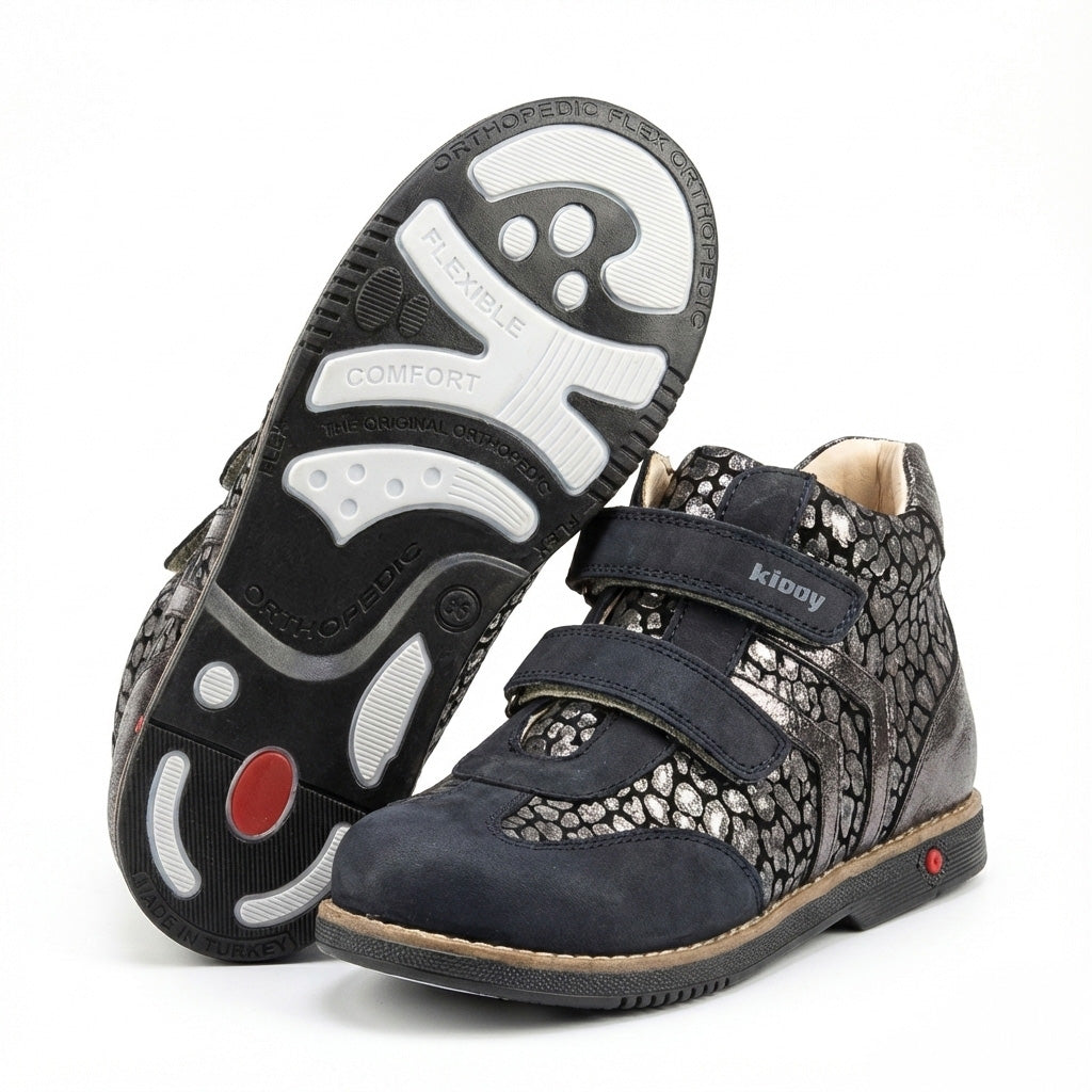 Kids’ orthopedic boots with Velcro straps, metallic pebble design, arch and ankle support, Thomas heels, and Kiddy logo.