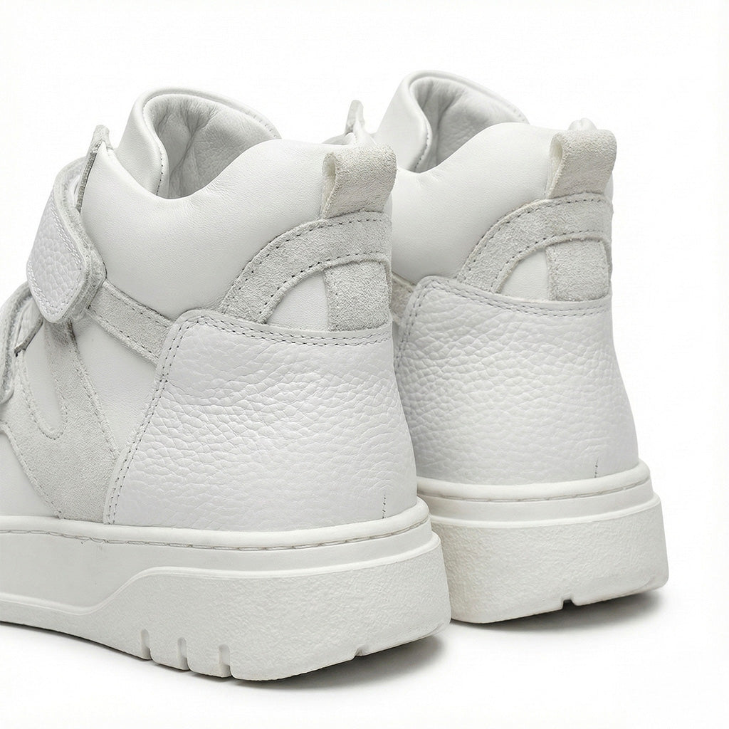 Supportive white orthopedic sneakers with textured leather, and rugged sole by Ortho Shoes.