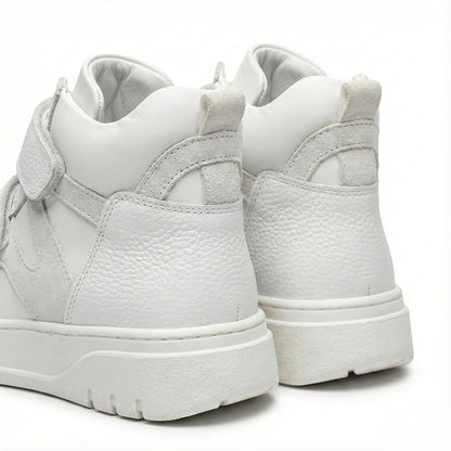 Supportive white orthopedic sneakers with textured leather, and rugged sole by Ortho Shoes.
