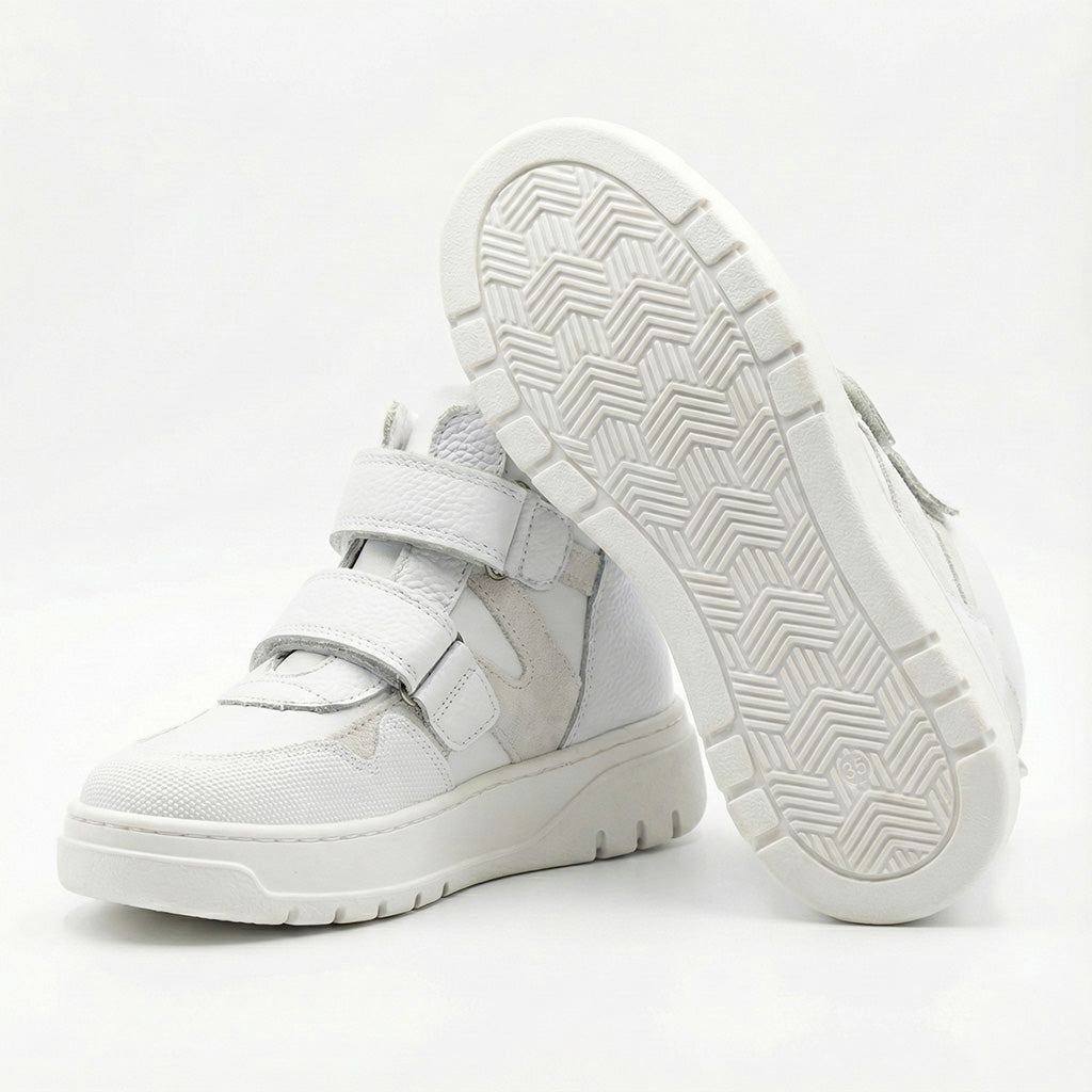 Children’s white orthopedic high-top sneakers with Velcro straps, ankle support, durable sole by Ortho Shoes.