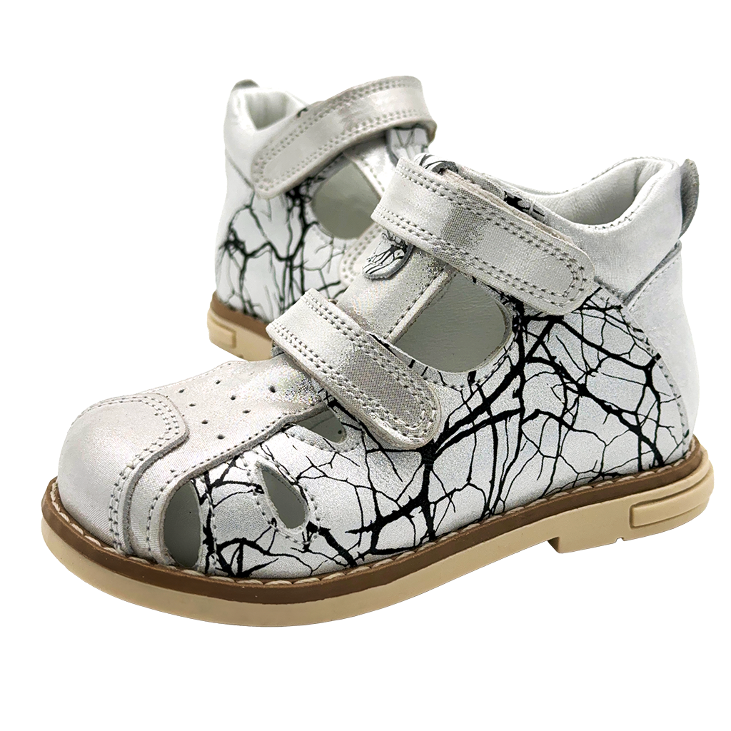 Kids orthopaedic closed sandals in white and black, featuring arch and ankle support, and Thomas heels.