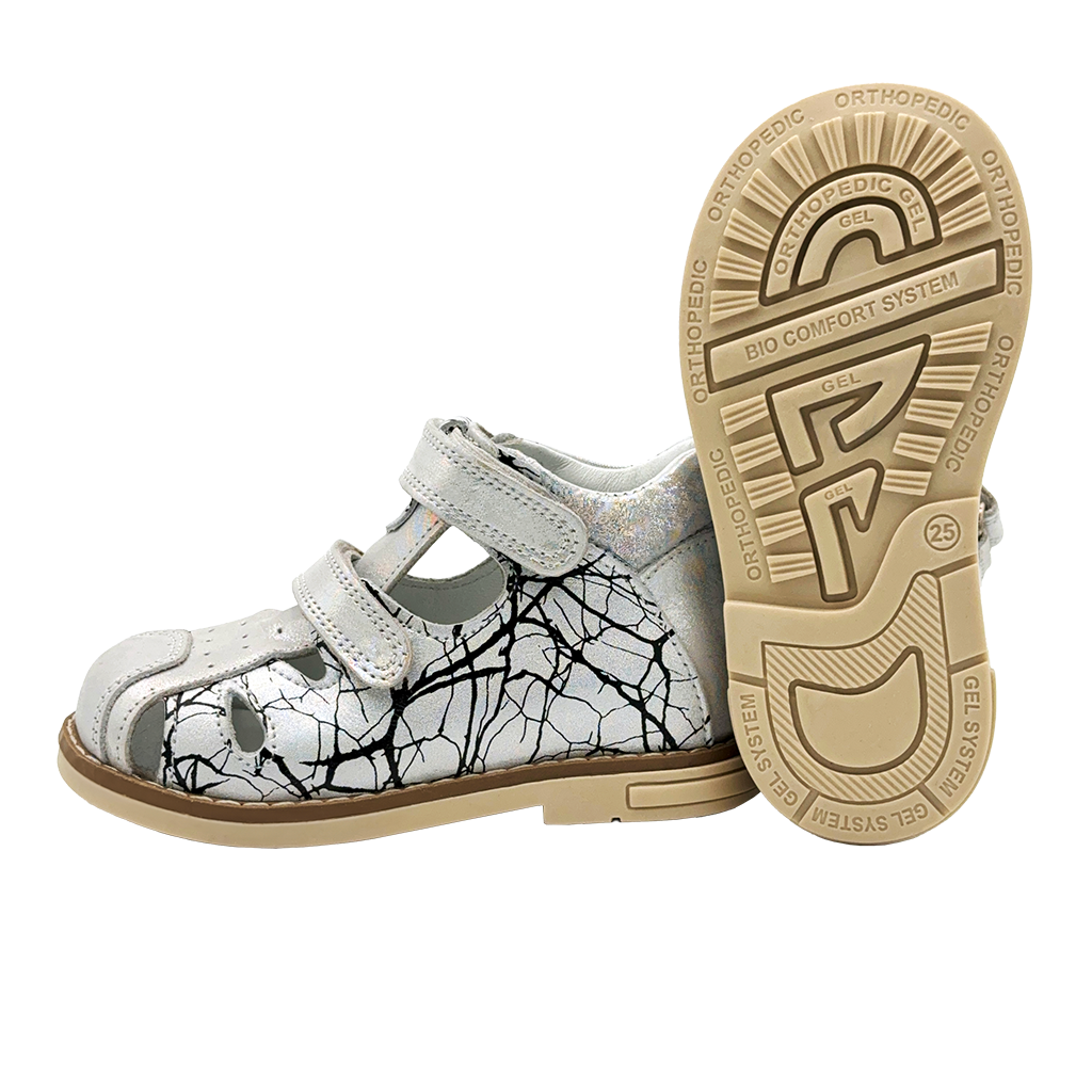Kids orthopaedic closed sandals in white and black, featuring arch and ankle support, and Thomas heels.