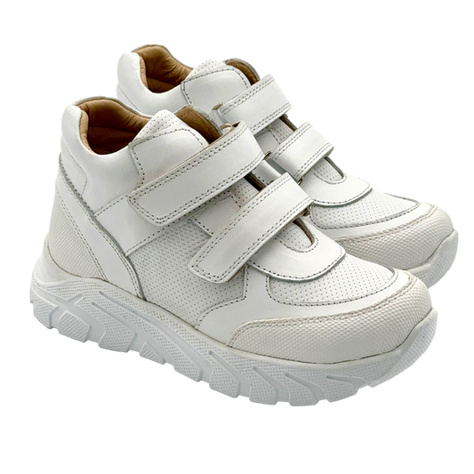 Photo of plain white supportive sneakers, designed with arch and ankle support for school dress code compliance.