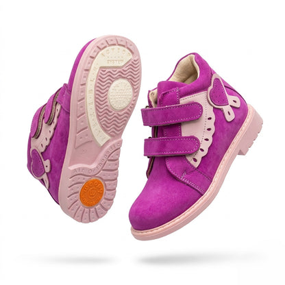 Kids’ magenta and pink orthopedic boots with Velcro straps, heart accent, scalloped trim, arch and ankle support, and Thomas heels by Woopy.