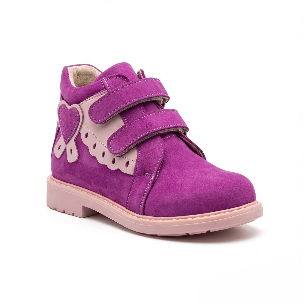 Kids’ magenta and pink orthopedic boots with Velcro straps, heart accent, scalloped trim, arch and ankle support, and Thomas heels by Woopy.
