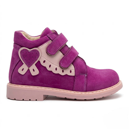 Kids’ magenta and pink orthopedic boots with Velcro straps, heart accent, scalloped trim, arch and ankle support, and Thomas heels by Woopy.