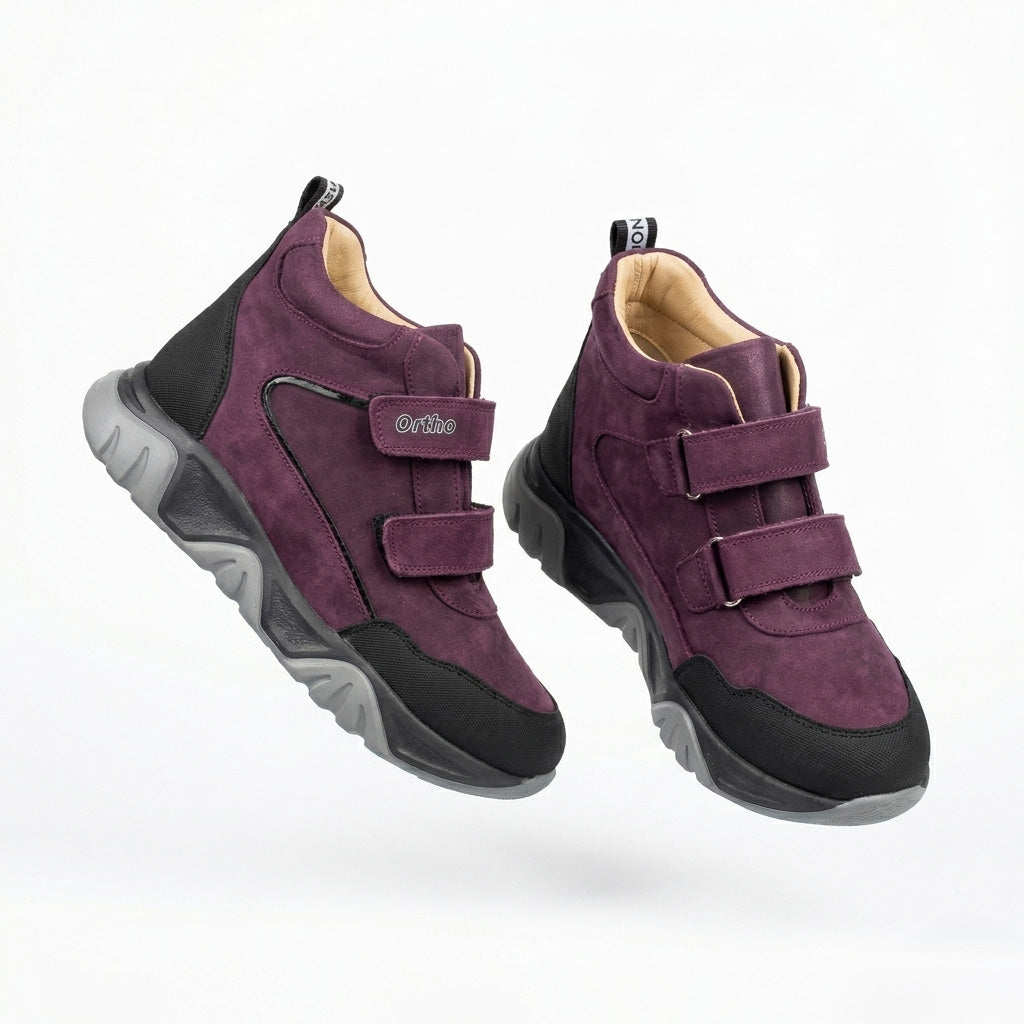 Teen girls’ orthopedic boots in dark purple and black with Velcro straps with arch and ankle support by Ortho.