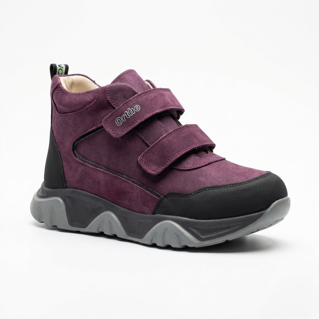 Teen girls’ orthopedic boots in dark purple and black with Velcro straps with arch and ankle support by Ortho.