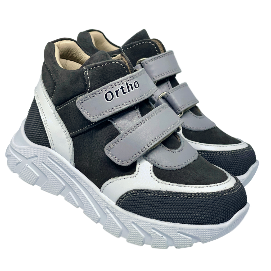 Photo of kids orthopedic grey-white sneakers with archa and high ankle support. Made by Ortho Shoes Australia.