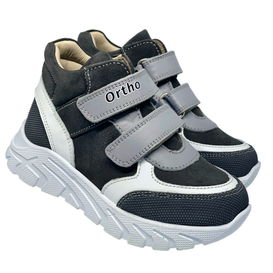 Photo of kids orthopedic grey-white sneakers with archa and high ankle support. Made by Ortho Shoes Australia.
